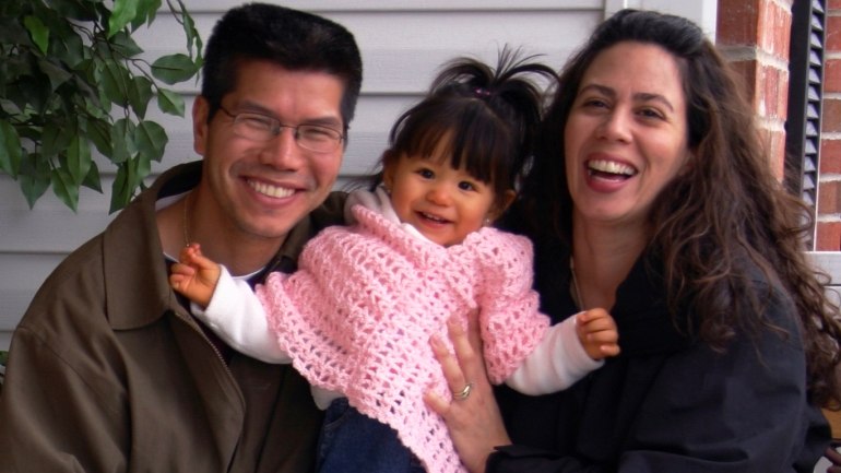 Young family outside their home